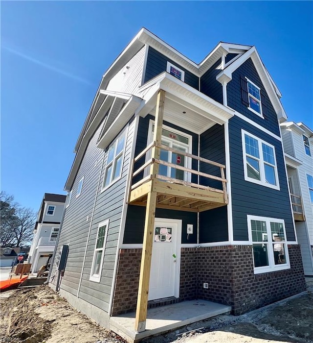 view of front of home featuring brick siding