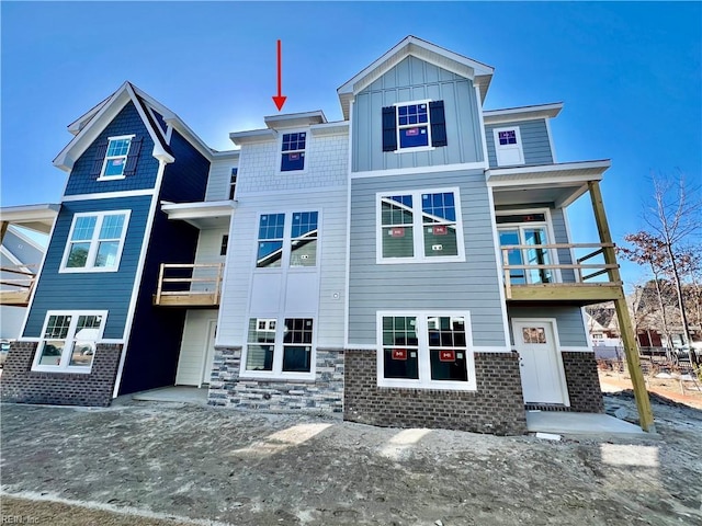 rear view of house featuring a balcony