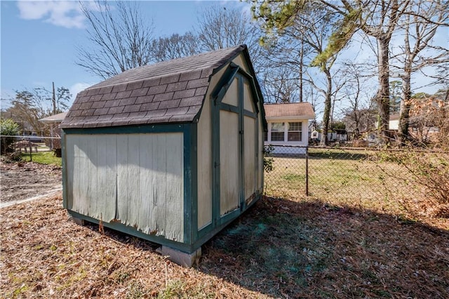 view of outbuilding featuring a lawn