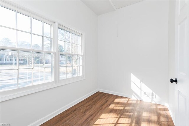 spare room featuring hardwood / wood-style flooring