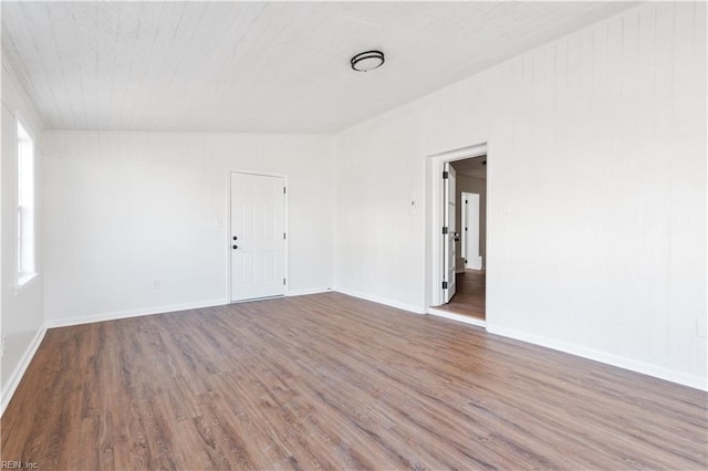 empty room with hardwood / wood-style flooring