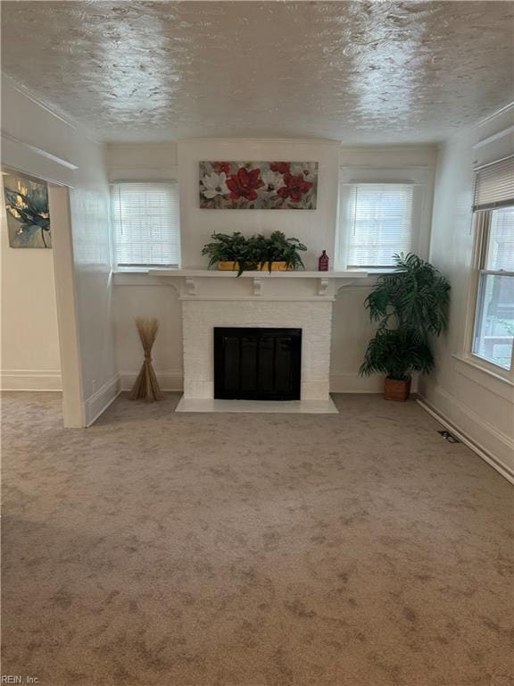 unfurnished living room with light carpet and a textured ceiling