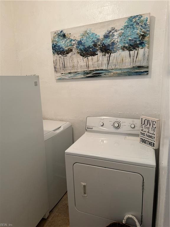 clothes washing area featuring washing machine and clothes dryer