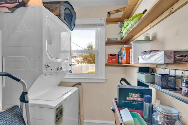 washroom with stacked washer / drying machine