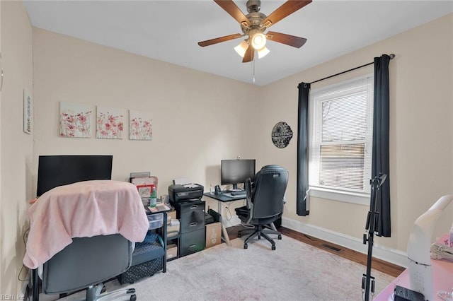 office area with hardwood / wood-style flooring and ceiling fan