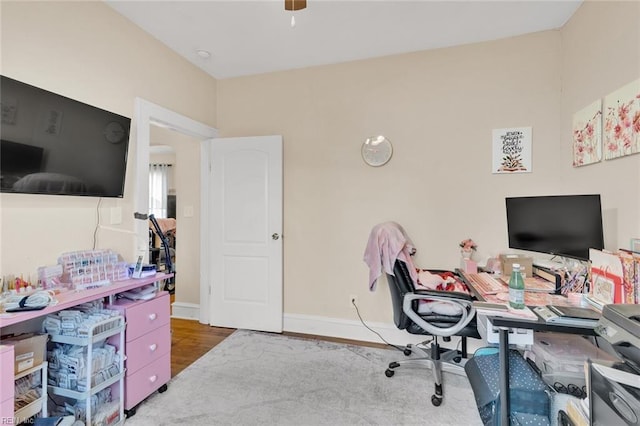 office area with hardwood / wood-style flooring and ceiling fan