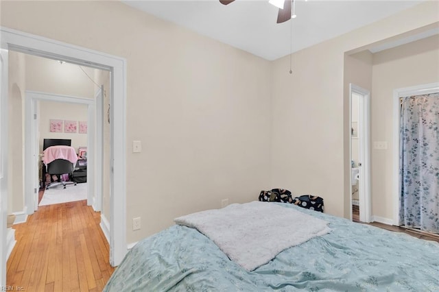 bedroom with ceiling fan and wood-type flooring