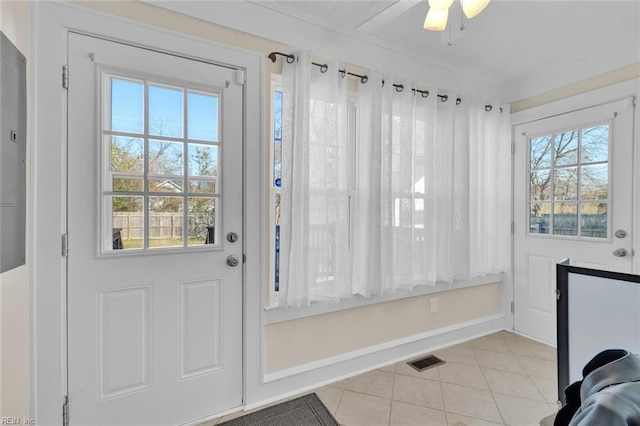 entryway with ceiling fan and light tile patterned floors