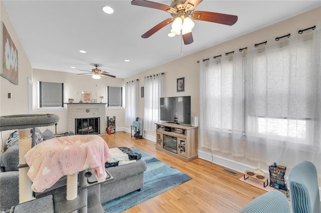 living room featuring hardwood / wood-style floors and a fireplace