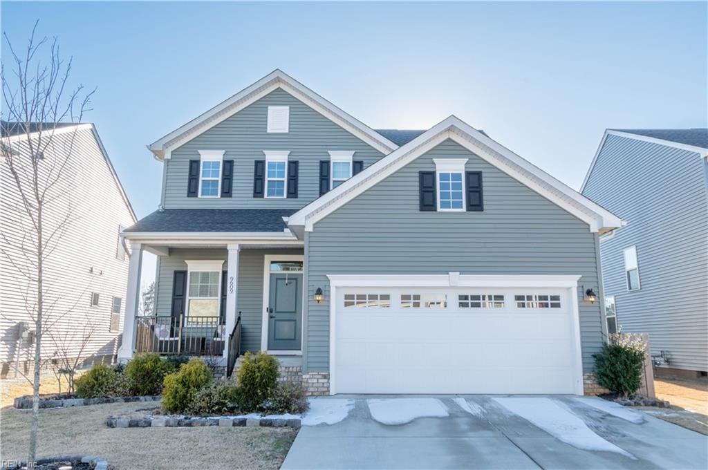 view of front of house with a garage and covered porch