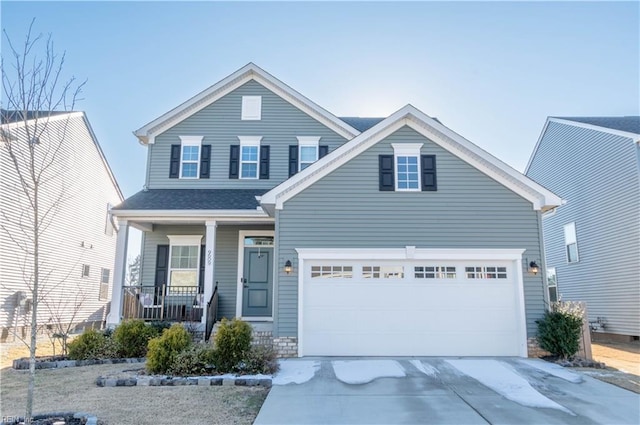 view of front of house with a garage and covered porch