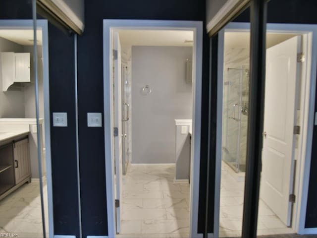 bathroom featuring vanity and an enclosed shower