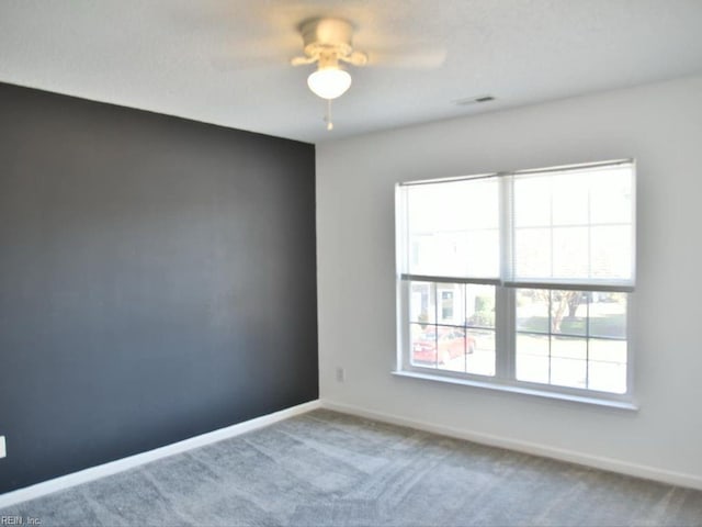 carpeted empty room with ceiling fan