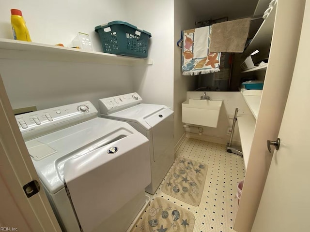 laundry area featuring sink and washing machine and dryer