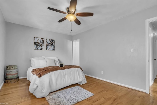 bedroom featuring ceiling fan and light wood-type flooring