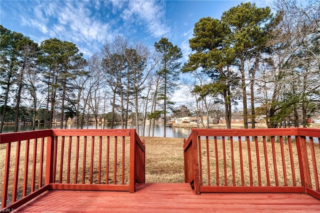 wooden deck featuring a water view