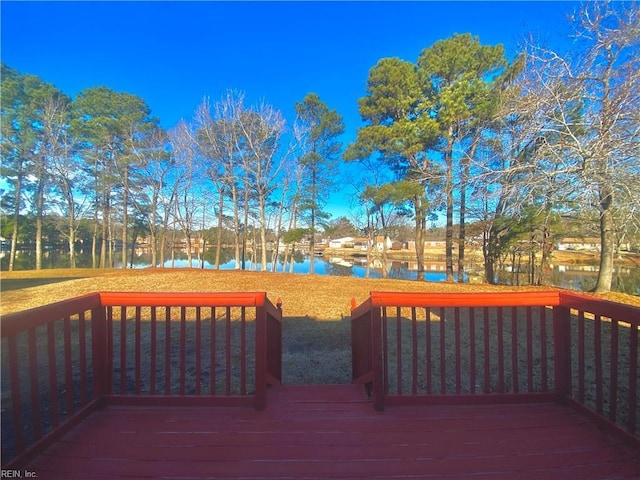 wooden deck with a water view