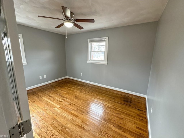 empty room featuring ceiling fan and light hardwood / wood-style floors