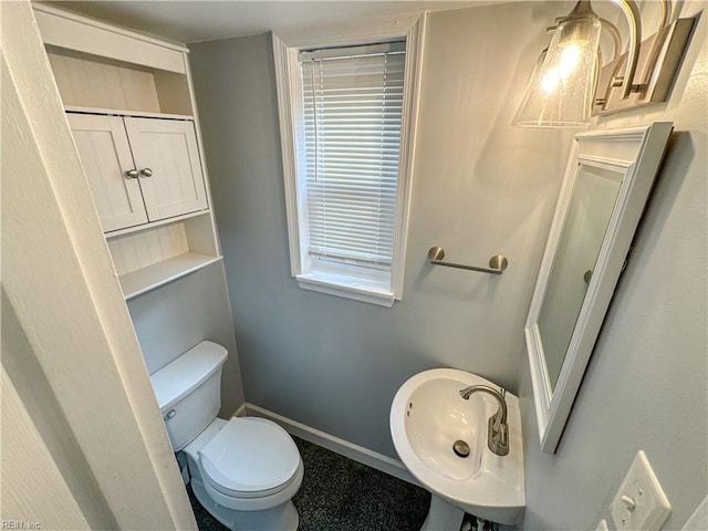 bathroom with sink and toilet