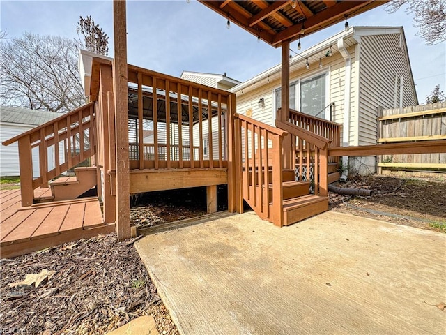 wooden terrace with a patio area