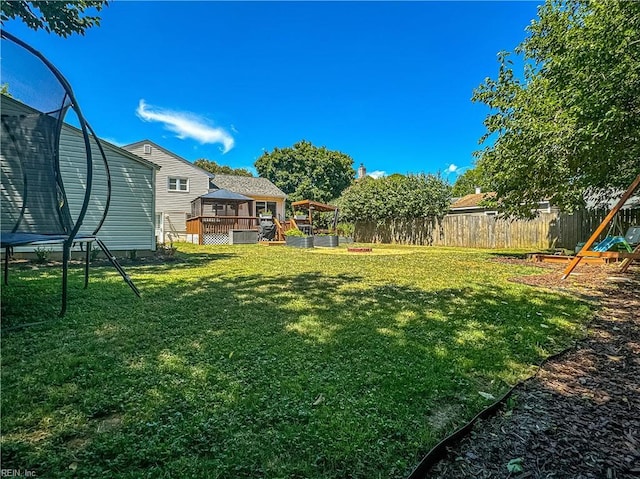 view of yard with a gazebo and a trampoline