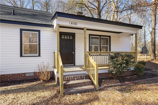 doorway to property with a porch