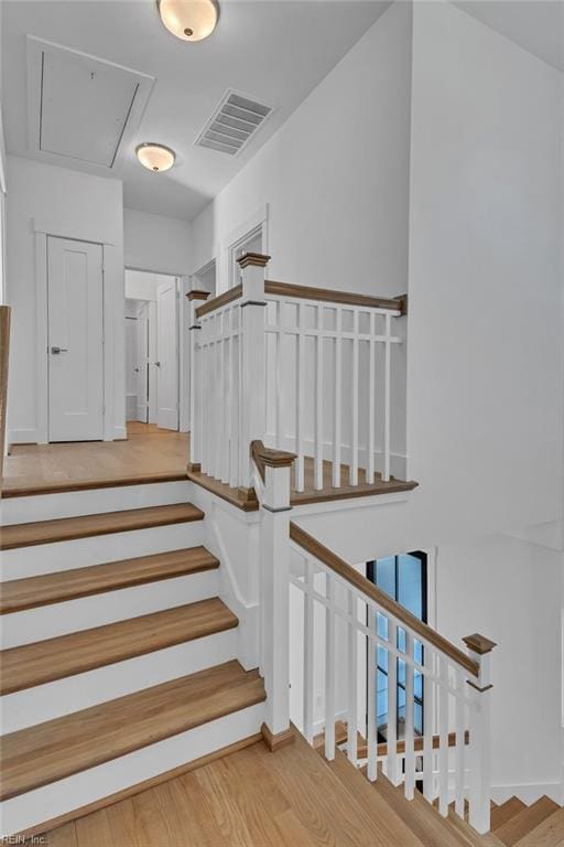 stairway featuring hardwood / wood-style floors