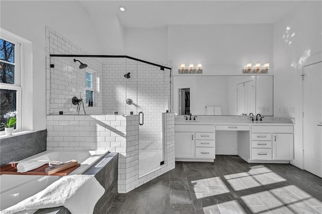 bathroom with vanity and plus walk in shower