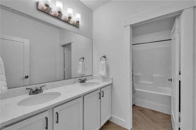 bathroom with vanity, parquet flooring, and shower / bath combination with curtain