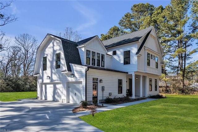 view of front of house featuring a garage and a front yard