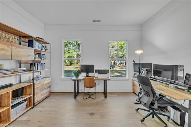 home office with light wood-type flooring