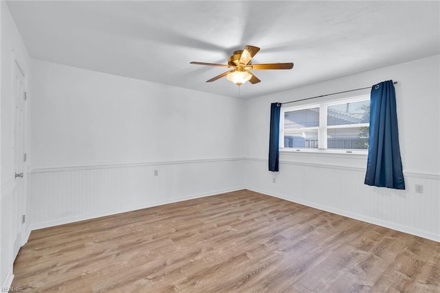 unfurnished room with ceiling fan and light hardwood / wood-style floors