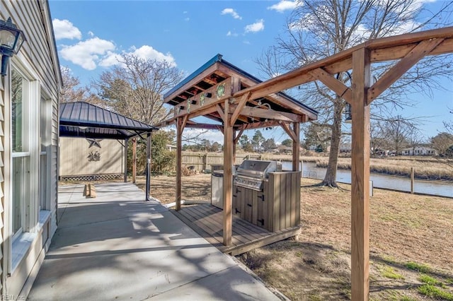 view of property's community with a gazebo and a water view