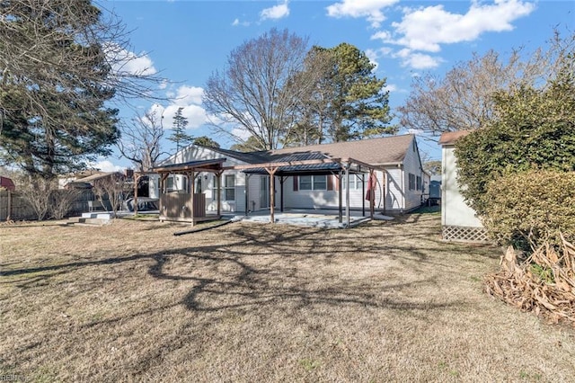 back of house featuring a gazebo, a yard, and a patio area