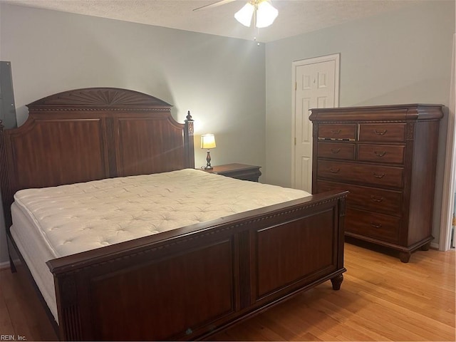 bedroom featuring ceiling fan and light hardwood / wood-style floors