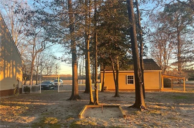 view of yard at dusk