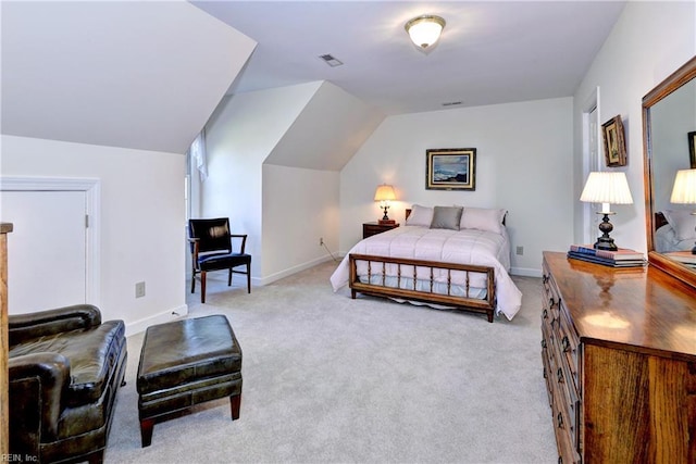 carpeted bedroom with vaulted ceiling