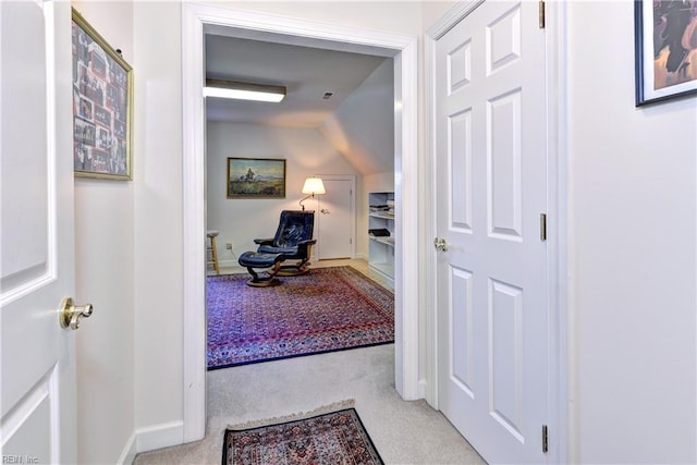 hallway with light carpet