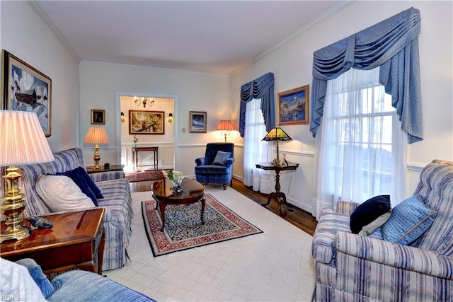 living room with ornamental molding and wood-type flooring