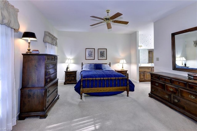 bedroom with ceiling fan and light colored carpet