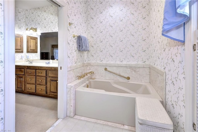 bathroom with tile patterned floors, vanity, and a bathtub