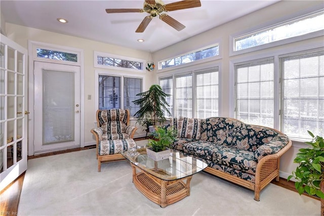 sunroom / solarium with plenty of natural light and ceiling fan