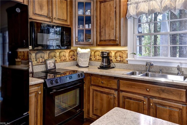 kitchen featuring sink and black appliances