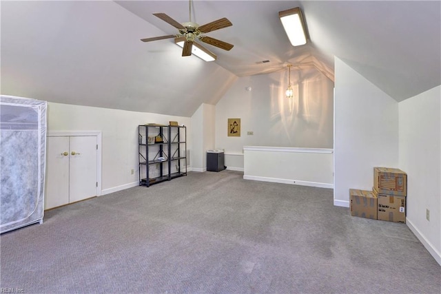 additional living space featuring ceiling fan, lofted ceiling, and carpet