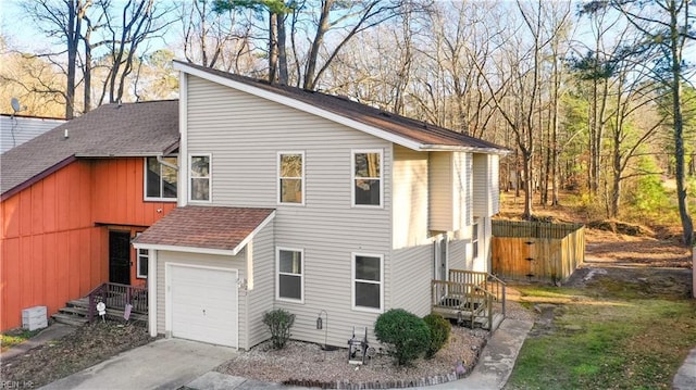 view of property exterior with a garage