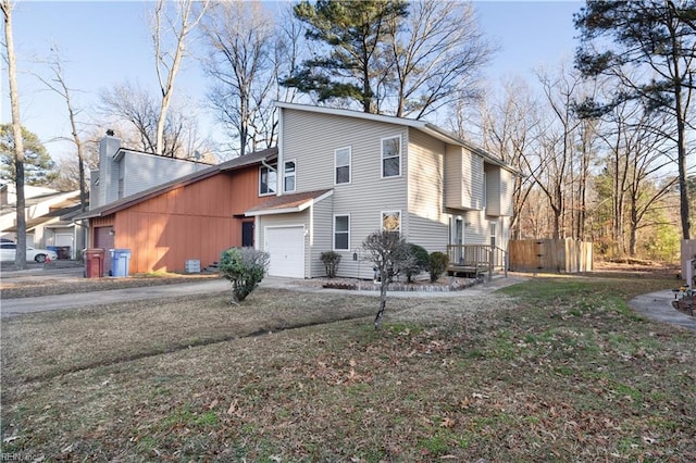 back of property with a garage