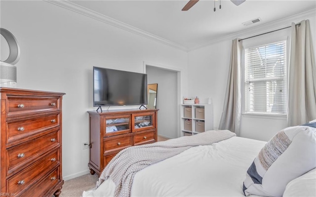 bedroom with crown molding, light carpet, and ceiling fan