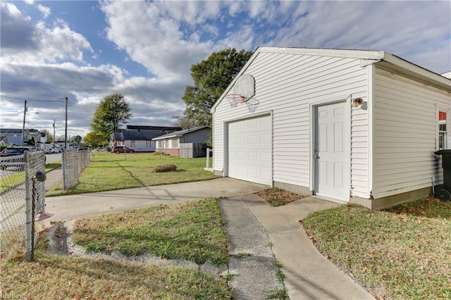 garage featuring a lawn