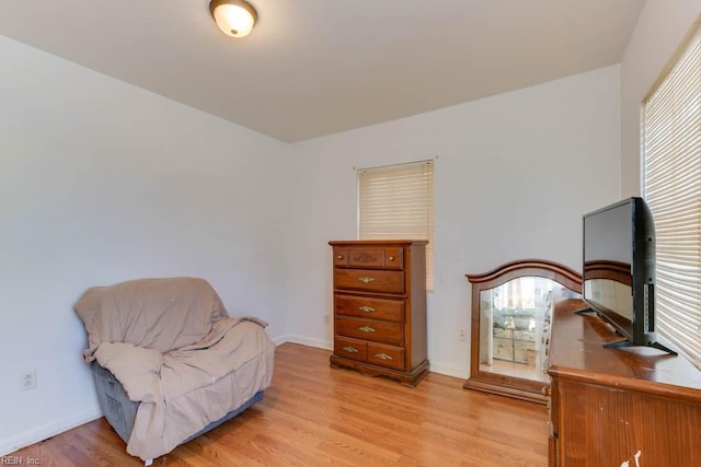 living area with light hardwood / wood-style flooring