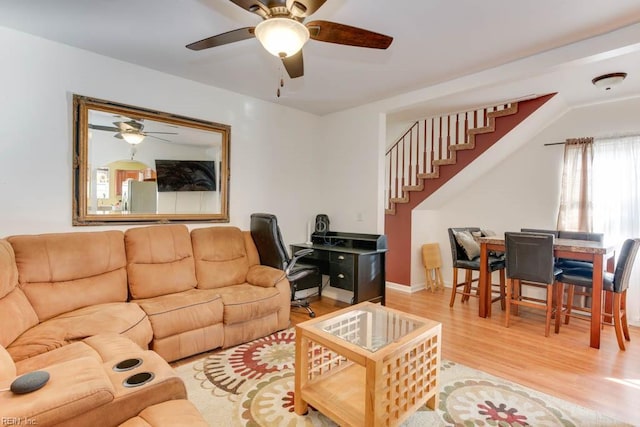 living room with ceiling fan and light hardwood / wood-style floors